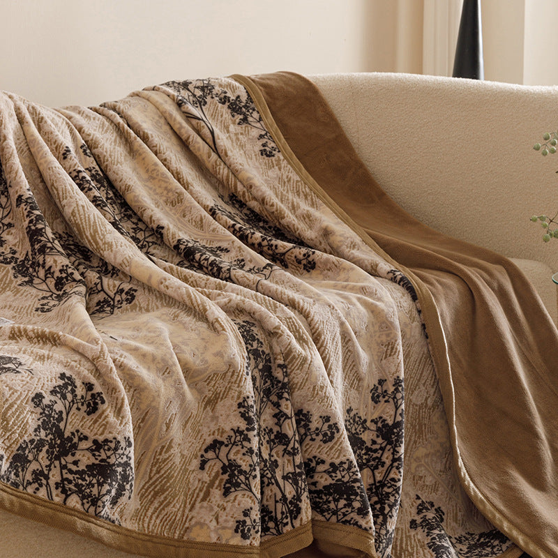 Botanical print plush throw blanket on a sofa – view 9