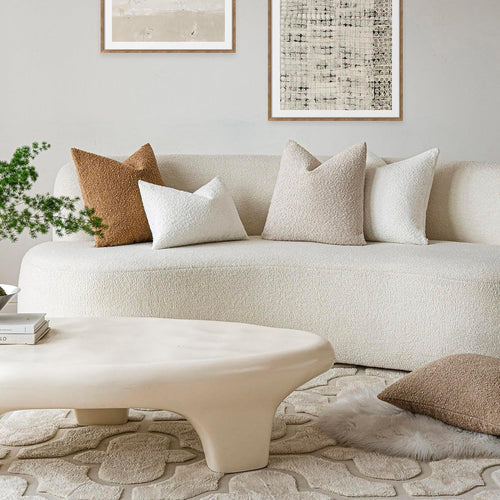 Bouclé pillow covers styled on a sofa