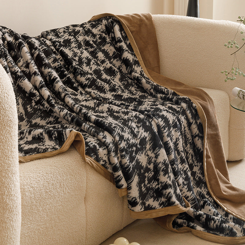 Botanical print plush throw blanket on a sofa – view 10