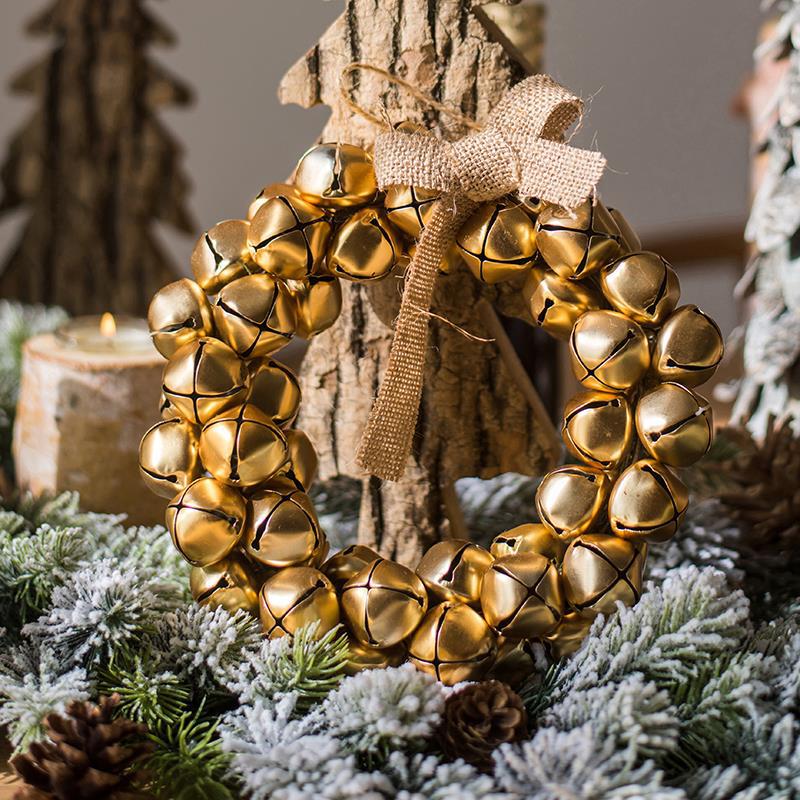 Rustic jingle bell Christmas wreath with burlap-style bow – view 1