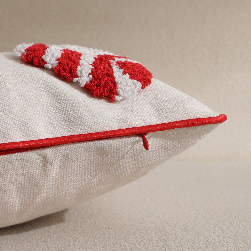 Close-up of tufted candy cane and red piped edge