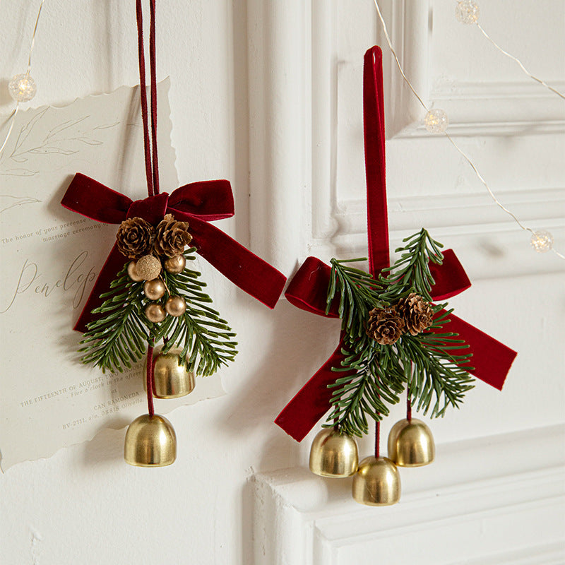 Burgundy velvet bow Christmas hanger with faux pine, pinecones and gold bells – view 1