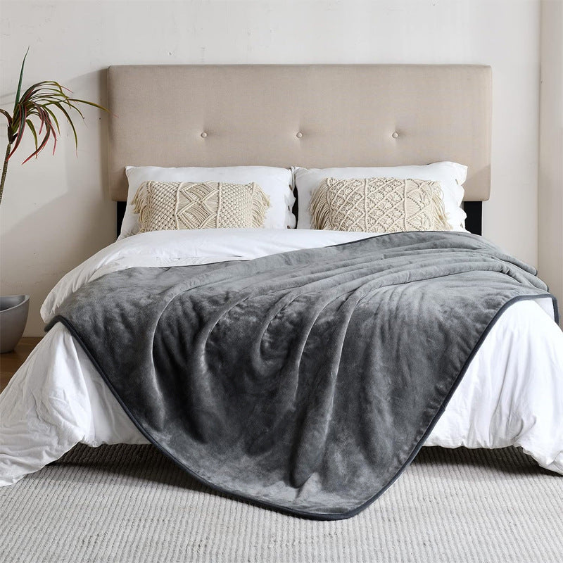 Beige sherpa pet blanket on a sofa with a small dog