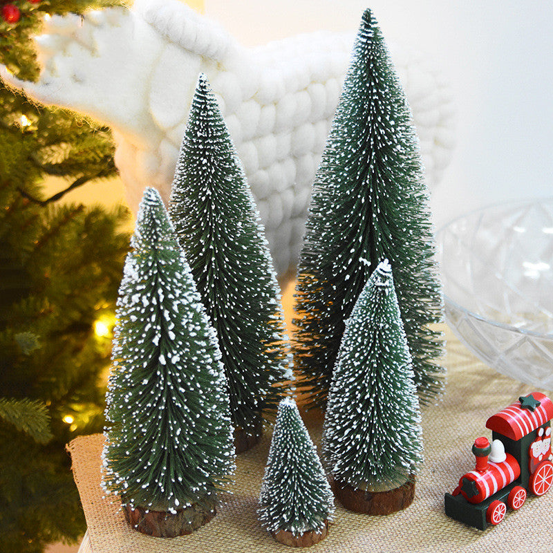 Frosted green bottle brush mini Christmas trees on wood slice bases – view 1