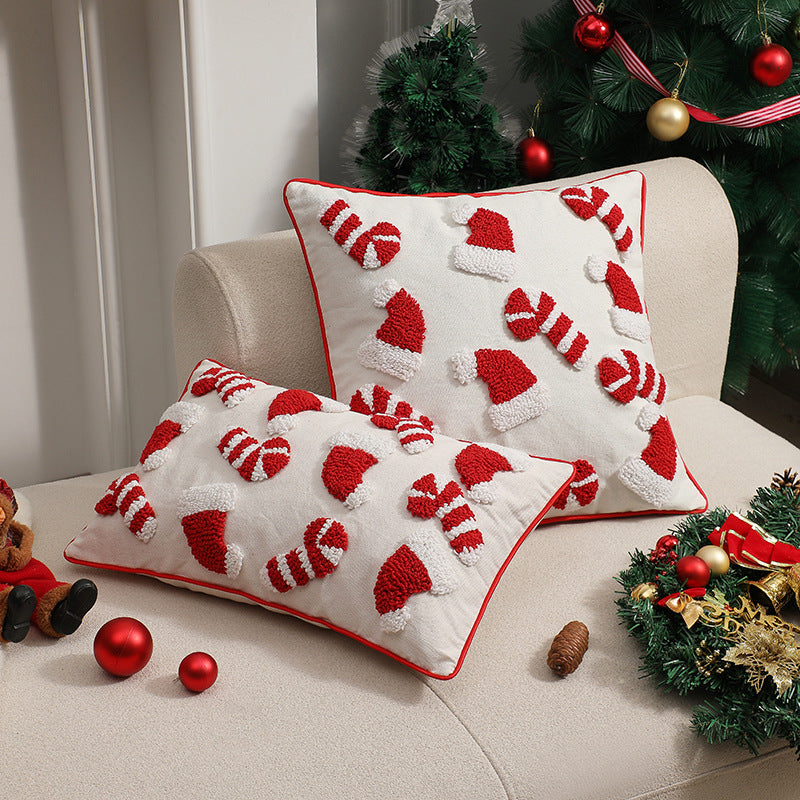 Tufted candy cane Christmas pillow covers styled on a sofa