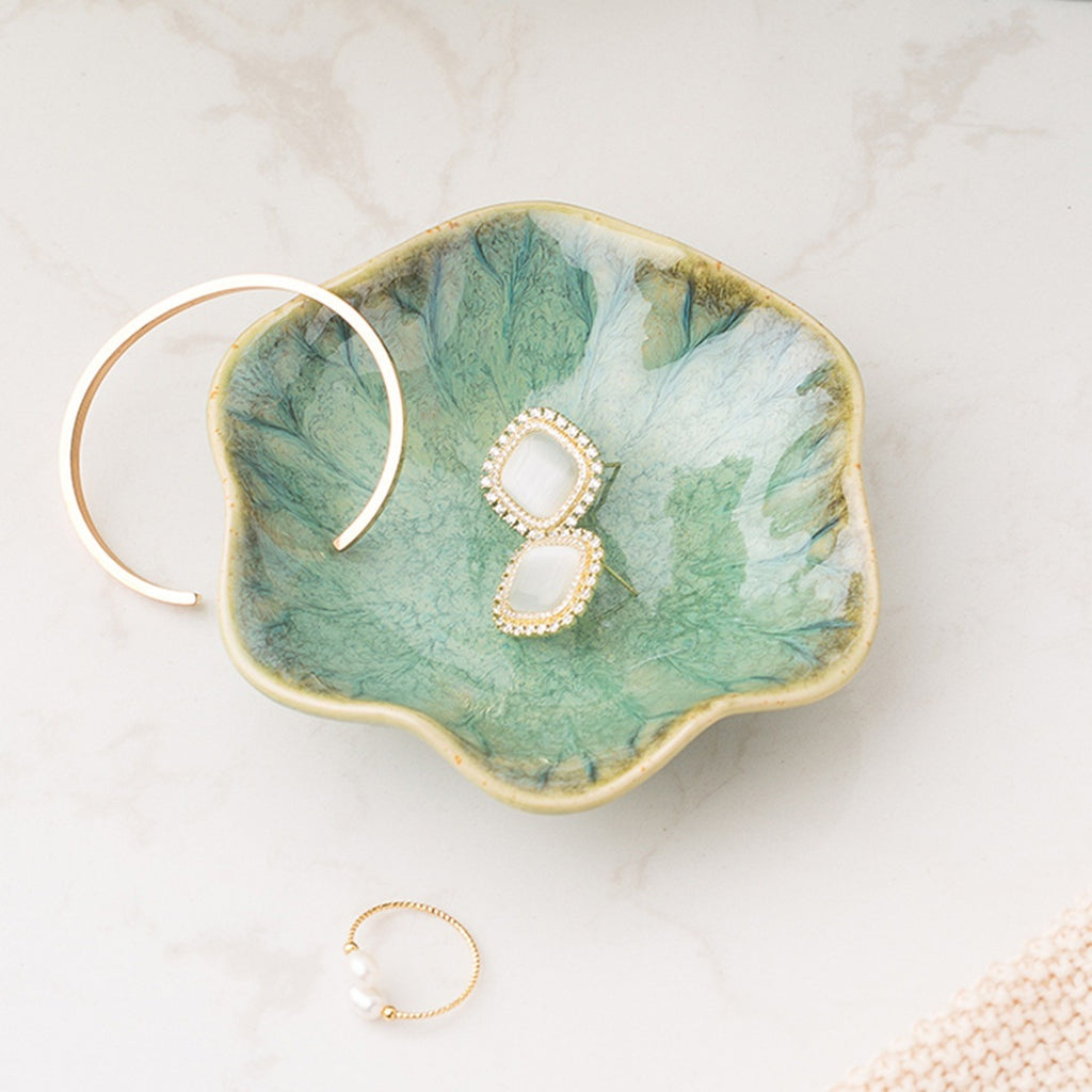 Lotus leaf ceramic trinket dish holding earrings – view 3