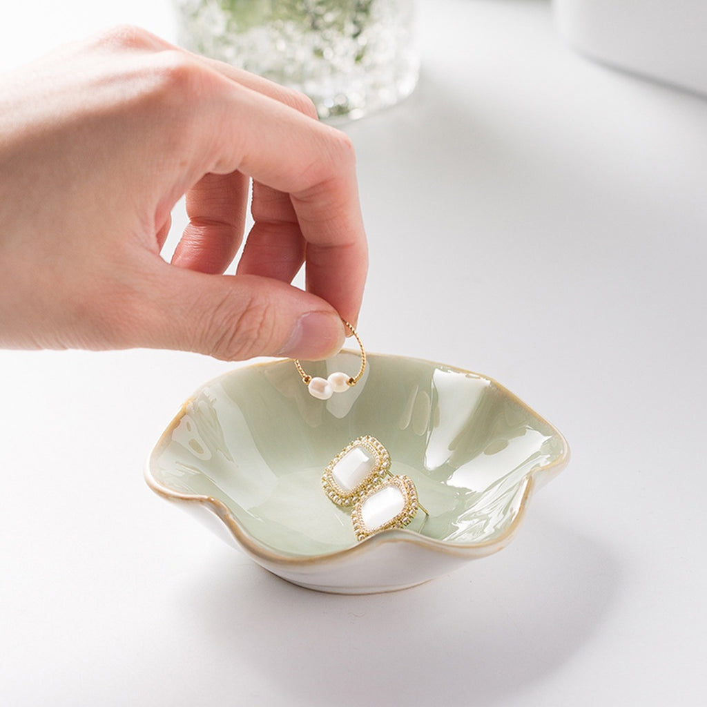 Lotus leaf ceramic trinket dish holding earrings – view 2