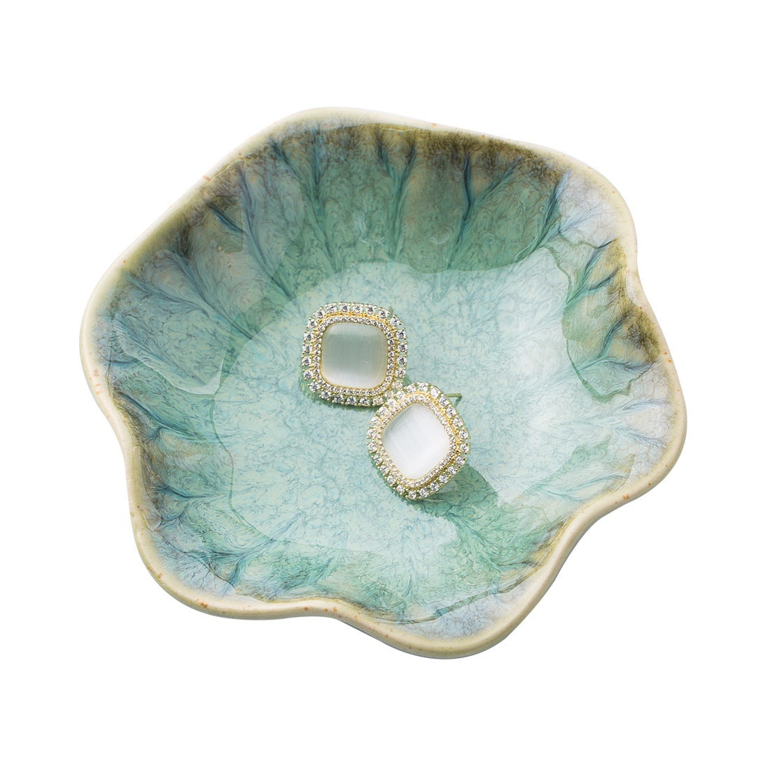 Lotus leaf ceramic trinket dish holding earrings – view 4