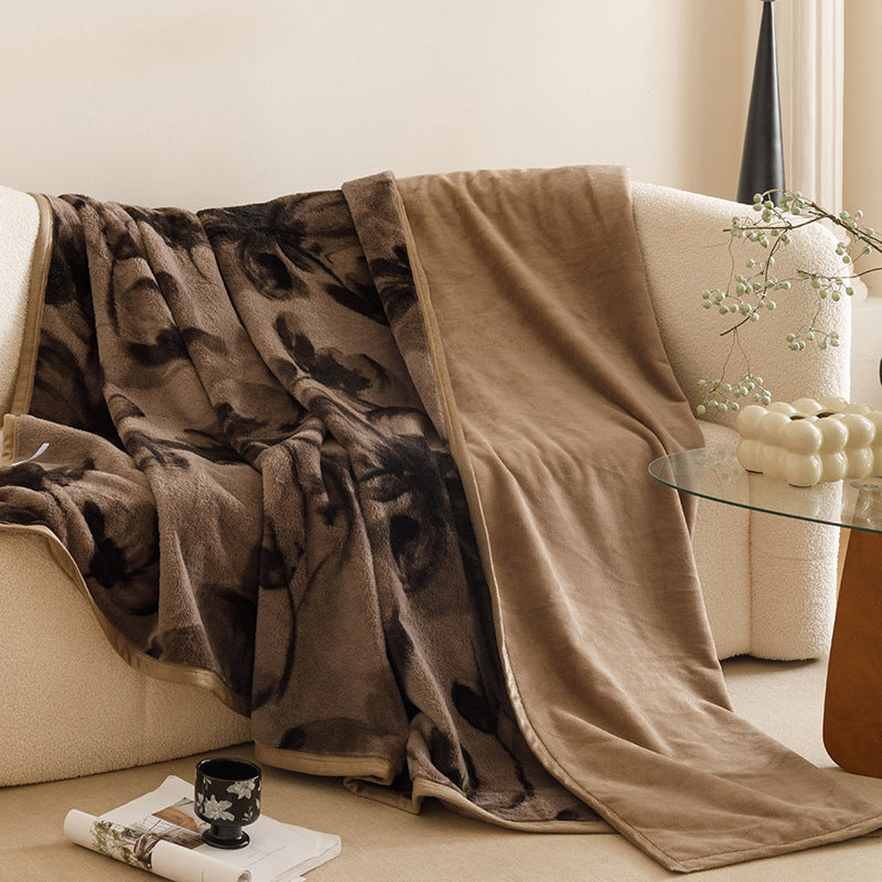 Botanical print plush throw blanket on a sofa – view 1