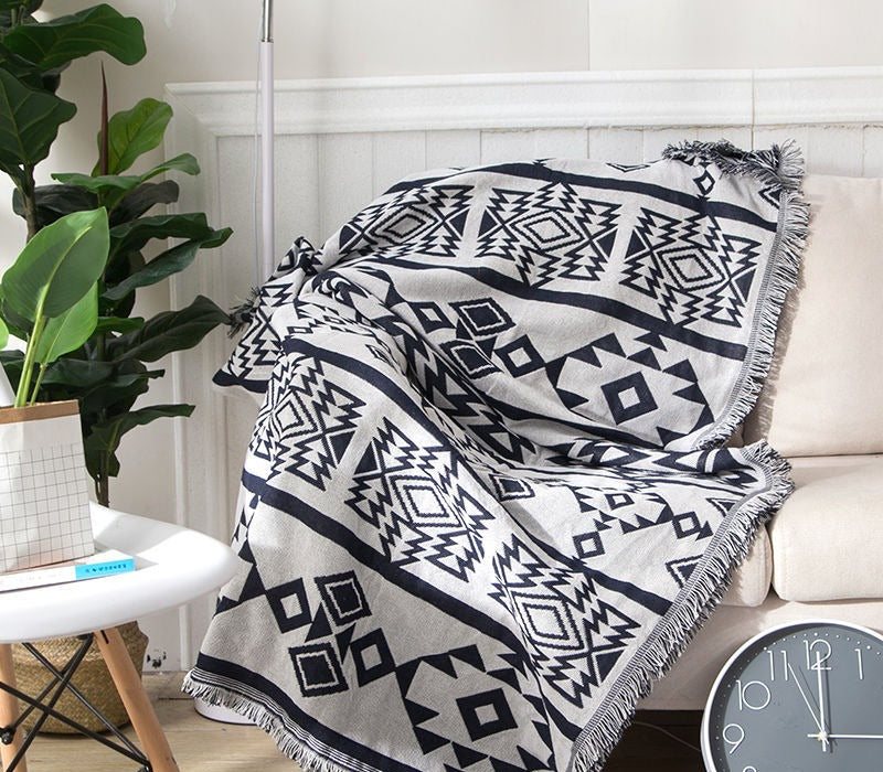 Geometric woven cotton throw with fringe – view 1