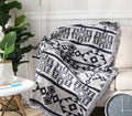 Geometric woven cotton throw with fringe – view 1
