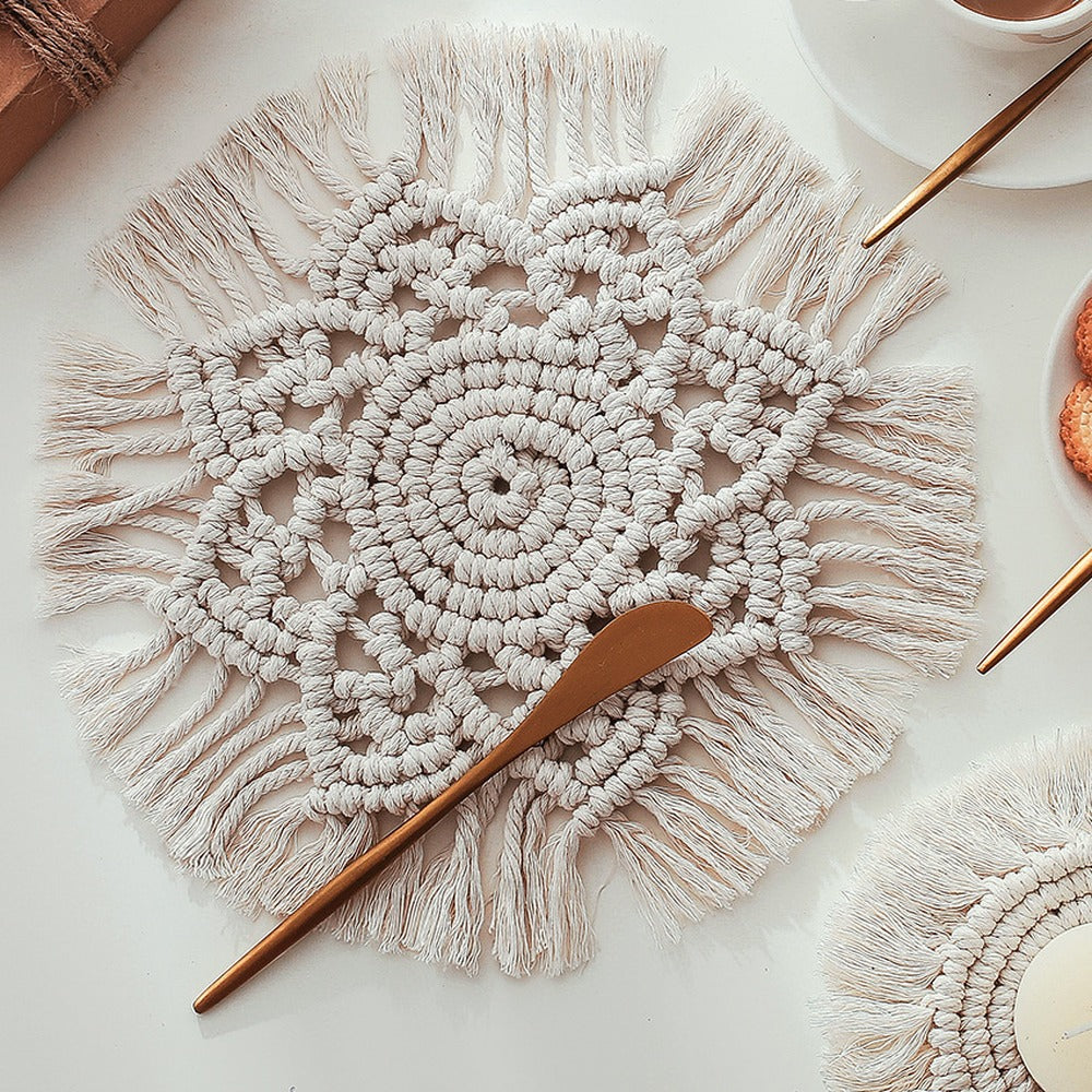 Round macramé table mat with fringed edge in natural off-white – view 1